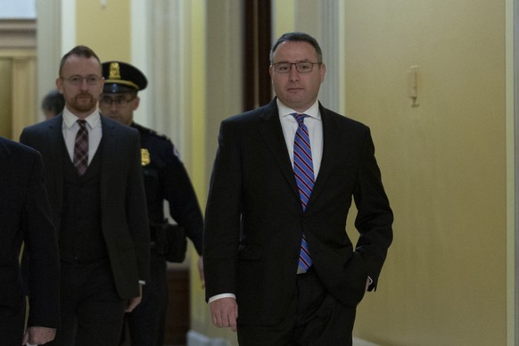 Lieutenant Colonel Alexander Vindman, a military officer at the National Security Council, right, arrives at the U.S. Capitol on Thursday, November 7, 2019 to review transcripts from his closed-door t ...