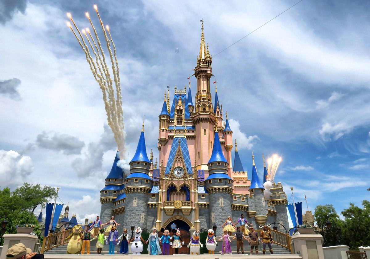 TRV-UST-DISNEY-WORLD-DINING-PLAN-DEALS-OS Daytime fireworks launch over Cinderella Castle during a performance of Mickey s Magical Friendship Faire in the Magic Kingdom at Walt Disney World, Bay Lake, ...