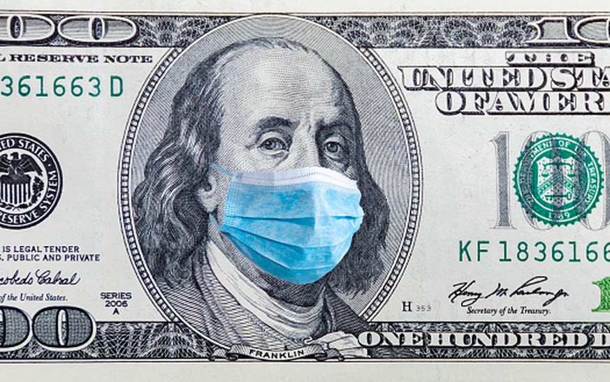 Coronavirus Wuhan. US quarantine, 100 dollar banknote with medical mask. The concept of epidemic and protection against coronavrius.