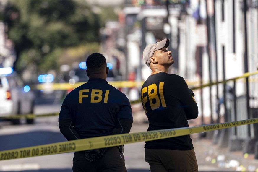 FBI agents survey the corners of Bourbon Street and Orleans Avenue, just a few blocks from where a man ramped a truck into a crowd at the edge of the French Quarter in the early morning hours of Wedne ...