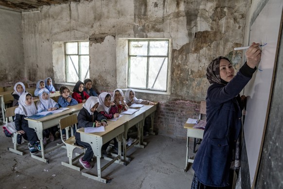 FILE - A teacher leads a girl&#039;s class on the first day of the school year, in Kabul, Afghanistan, on Saturday, March 25, 2023. (AP Photo/Ebrahim Noroozi, File)