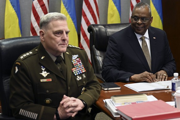 Defense Secretary Lloyd Austin, right, and Chairman of the Joint Chiefs of Staff Gen. Mark Milley, attend a virtual meeting of the Ukraine Defense Contact Group, Wednesday, March 15, 2023, at the Pent ...