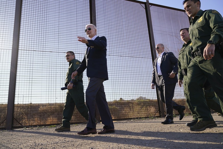 FILE - President Joe Biden walks along a stretch of the U.S.-Mexico border in El Paso Texas, Jan. 8, 2023. The Biden administration will open migration centers in South and Central America for asylum  ...