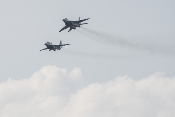 FILE - MIG-29 fighter jets in flight at the 11th SIAF International Aviation Day at the Malacky-Kuchyna Air Base, in Kuchyna, Slovakia, Saturday, Aug. 27, 2022. Slovakia’s government has approved a pl ...