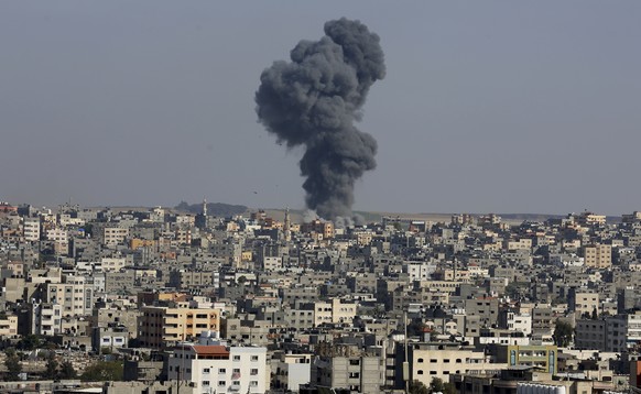Smoke rises after an Israeli airstrike in Gaza in Gaza City, Wednesday, May 12, 2021. (AP Photo/Adel Hana)