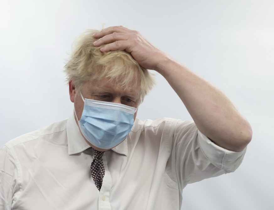 FILE - Britain&#039;s Prime Minister Boris Johnson gestures during a visit to Finchley Memorial Hospital, in North London, Tuesday, Jan. 18, 2022. London police say they are now investigating Downing  ...