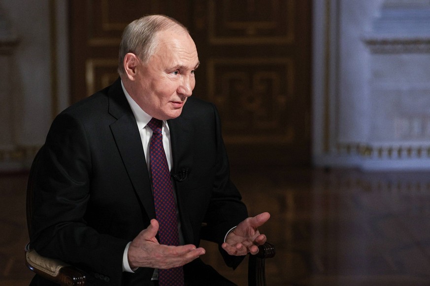 RUSSIA, MOSCOW - MARCH 12, 2024: Russias President Vladimir Putin gives an interview to Rossiya Segodnya media group general director Dmitry Kiselev. Gavriil Grigorov/Russian Presidential Press and In ...
