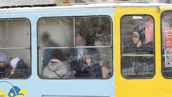 November 17, 2022, Lviv, Ukraine: People ride in a tram in Lviv. The first snow of this season fell at night. The approach of winter will bring more difficult conditions to Ukraine, including heavy mu ...