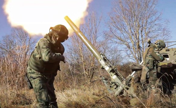 NOVEMBER 27, 2023: A 2S4 Tyulpan 240mm self-propelled mortar of the Zapad group of forces is engaged in the Kupyansk direction of a special military operation. Best quality available. Video screen gra ...