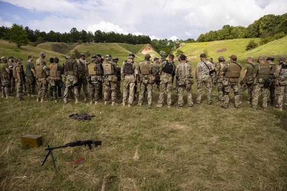 Photograph dated June 23, 2022 showing Azov Army fighters during training, outside Kharkiv, Ukraine issued 24 June 2022. For the Ukrainians they are national heroes, for the Russians a neo-Nazi militi ...