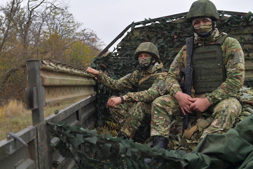 Russia Ukraine Military Operation Artillery Unit 8546181 26.10.2023 Russian servicemen of an artillery unit ride a truck, in the course of Russia s military operation in Ukraine, in Zaporizhzhia regio ...