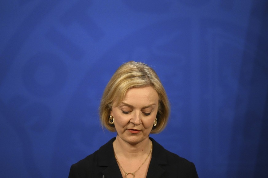 Britain's Prime Minister Liz Truss holds a press conference in the Downing Street Briefing Room in central London, Friday Oct. 14, 2022. Embattled British Prime Minister sacked her Treasury chief and  ...