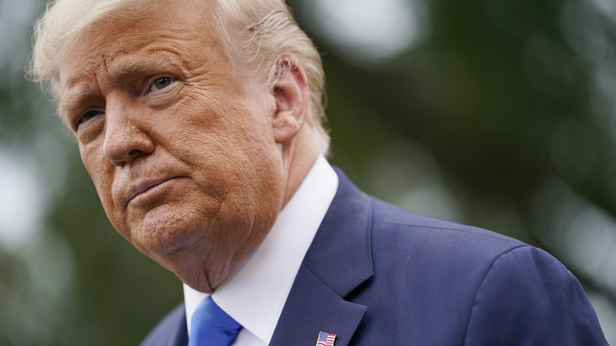 President Donald Trump speaks to members of the press on the South Lawn of the White House in Washington, Thursday, Sept. 24, 2020, before boarding Marine One for a short trip to Andrews Air Force Bas ...