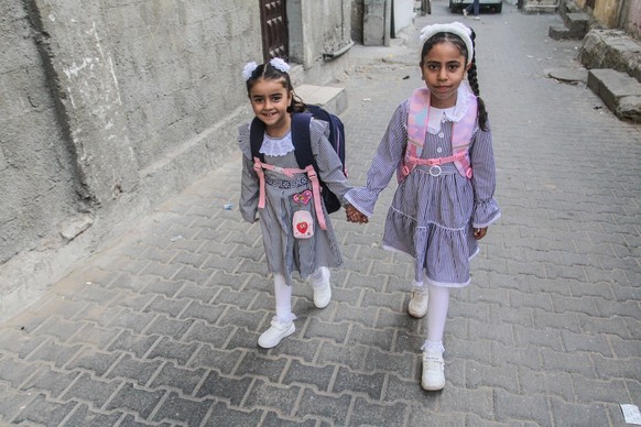 August 26, 2023, Gaza City, The Gaza Strip, Palestine: Palestinian children in school uniforms head to the first day of the new academic year in the Jabalia camp in the northern Gaza Strip. Gaza City  ...