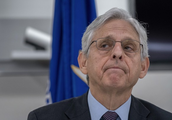 Attorney General Merrick Garland listens during a press event to announce the results of an enforcement surge to reduce the fentanyl supply across the United States, at DEA headquarters, Arlington, Va ...
