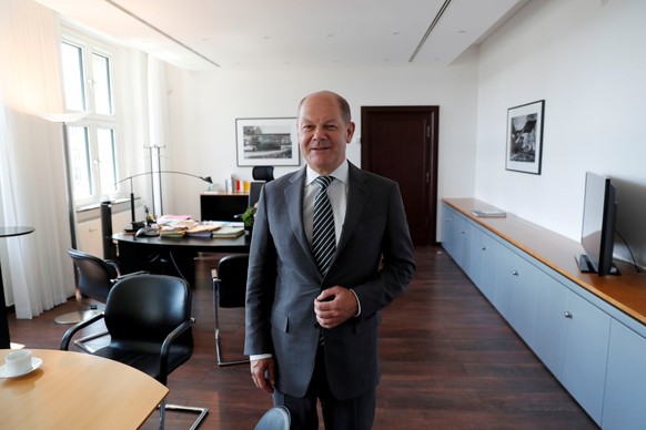 FILE PHOTO: German Finance Minister Olaf Scholz is pictured in his office during an interview with Reuters in Berlin, Germany, June 5, 2019. REUTERS/Fabrizio Bensch - RC1F6D22D440/File Photo