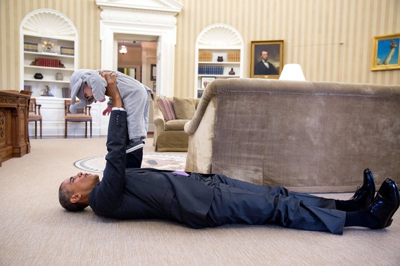 Oct. 30, 2015 - Washington, District of Columbia, US - U.S President BARACK OBAMA lifts ELLA RHODES, daughter of Deputy National Security Advisor Ben Rhodes, in her elephant costume during a Halloween ...