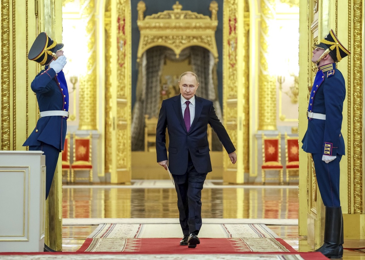 Russian President Vladimir Putin enters a hall to attend a ceremony at the Kremlin in Moscow, Russia, Monday, June 23, 2025. (Alexander Kazakov, Sputnik, Kremlin Pool Photo via AP)