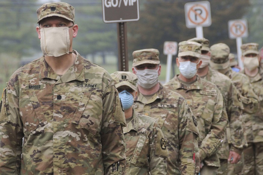 April 8, 2020 - Joint Base McGuire-Dix-Lakehurst, New Jersey, USA - Reserve Urban Augmentation Medical Task Force Soldiers board buses at Joint Base McGuire-Dix-Lakehurst, New Jersey, to deploy to loc ...