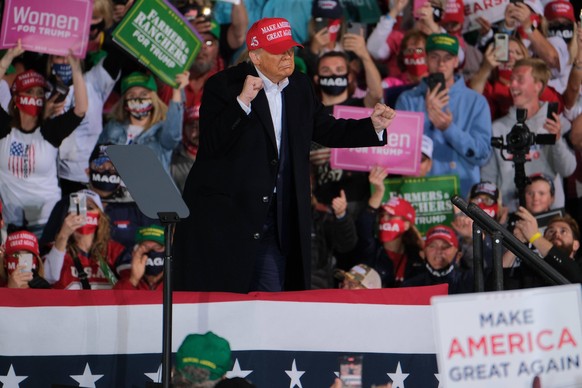 October 14, 2020, Des Moines, Iowa, U.S: US President DONALD TRUMP dances to The Village People s hit song oeYMCA during a campaign stop in Des Moines, Iowa on October 14, 2020. The rally is Trump s t ...