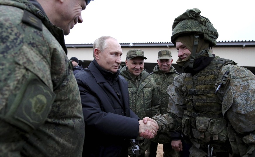 October 20, 2022, Ryazan, Ryazan Oblast, Russia: Russian President Vladimir Putin greets an army reservist called up for military training during a visit to the Western Military District training area ...