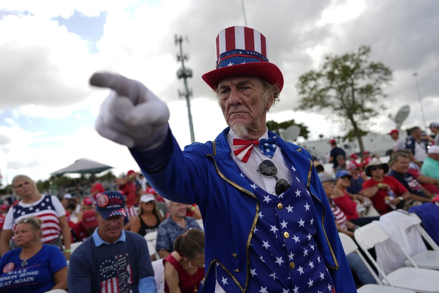 Duane Schwingel, dressed as Uncle Sam, arrives before former President Donald Trump speaks at a campaign rally in support of the campaign of Sen. Marco Rubio, R-Fla., at the Miami-Dade County Fair and ...