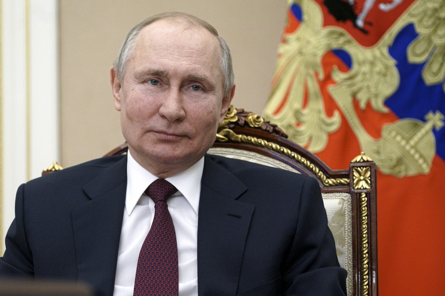 Russian President Vladimir Putin attends a meeting on social and economic development of Crimea and Sevastopol, via video conference in Moscow, Russia, Thursday, March 18, 2021. (Sputnik, Kremlin Pool ...