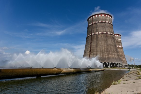 Water jets spring from pipes leading to cooling towers as part of the essential service water system (ESWS) at the Zaporizhzhia Nuclear Power Plant, Enerhodar, Zaporizhzhia Region, southeastern Ukrain ...