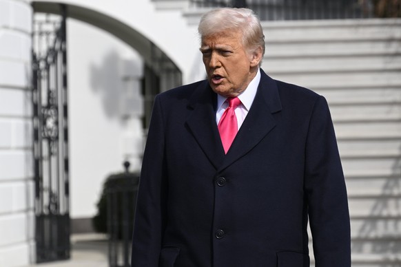 President Donald Trump speaks to reporters before departing the White House en route to the Conservative Political Action Conference, CPAC, Saturday, Feb. 22, 2025, in Washington. (AP Photo/John McDon ...