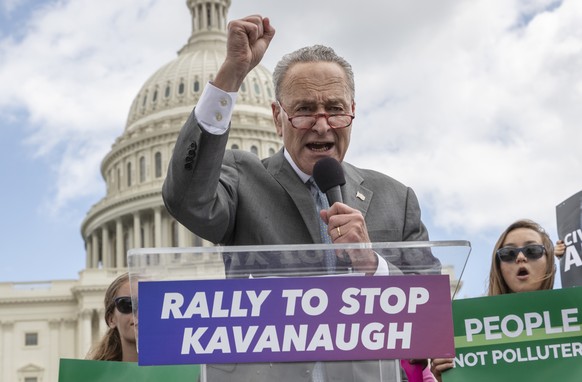 FILE - In this Aug. 1, 2018 file photo, Senate Minority Leader Chuck Schumer, D-N.Y., joins protesters objecting to President Donald Trump's Supreme Court nominee Brett Kavanaugh at a rally Capitol in ...