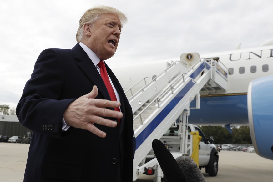 President Donald Trump delivers a statement on Pastor Andrew Brunson after landing at Cincinnati Municipal Lunken Airport, Friday, Oct. 12, 2018, in Cincinnati, Ohio. The president is en route to camp ...