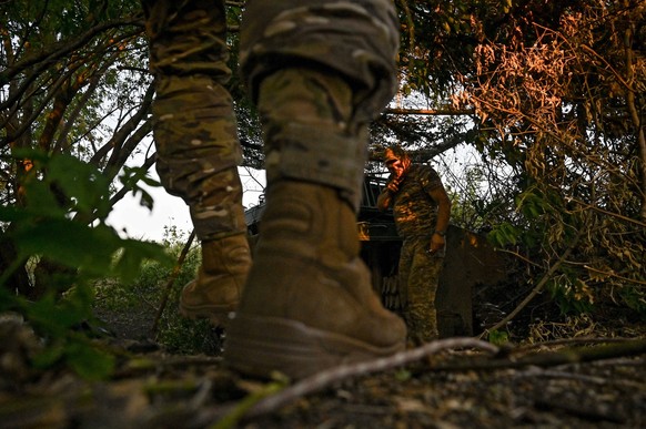 Ukrainian artillery unit near Chasiv Yar DONETSK REGION, UKRAINE - JULY 14, 2024 - Andrii, a commander of an artillery crew of the 24th King Danylo Separate Mechanized Brigade, carries out a combat mi ...