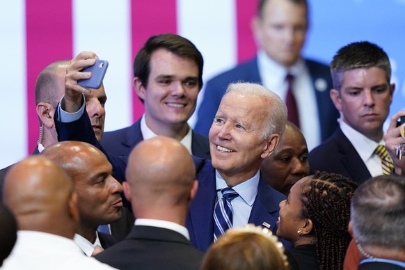President Joe Biden takes photos with supporters after speaking at the Arnaud C. Marts Center on the campus of Wilkes University, Tuesday, Aug. 30, 2022, in Wilkes-Barre, Pa. (AP Photo/Matt Slocum)
