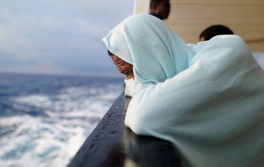 A migrant sits on board NGO Proactiva Open Arms rescue boat in central Mediterranean Sea, August 5, 2018. REUTERS/Juan Medina TPX IMAGES OF THE DAY TPX IMAGES OF THE DAY