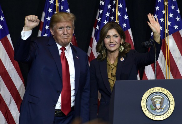 FILE - President Donald Trump appears with Gov. Kristi Noem in Sioux Falls, S.D., Sept. 7, 2018. As his rivals spend the day holding town halls and meet-and-greets in early-voting states, Donald Trump ...