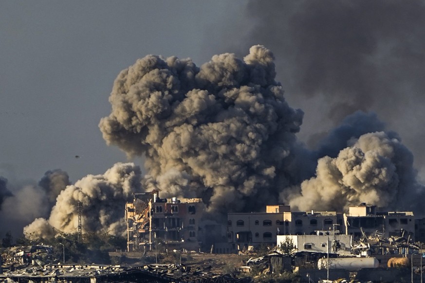 FILE - Smoke rises following an Israeli bombardment in the Gaza Strip, as seen from southern Israel, Saturday, Dec. 16, 2023. South Africa has launched a case at the United Nations&#039; top court all ...