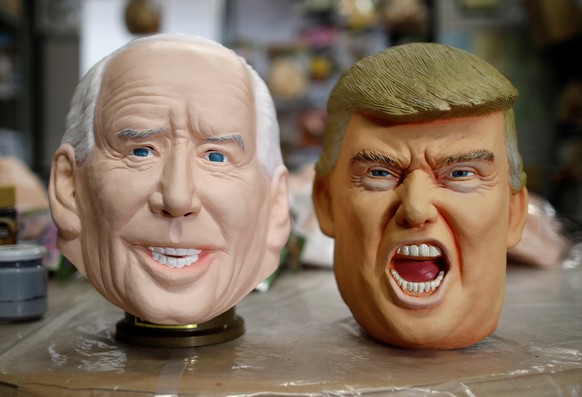 Masks depicting U.S. President-elect Joe Biden and President Donald Trump are displayed at Ogawa Studios, a mask and toy making company, in Saitama, Japan November 12, 2020. REUTERS/Issei Kato