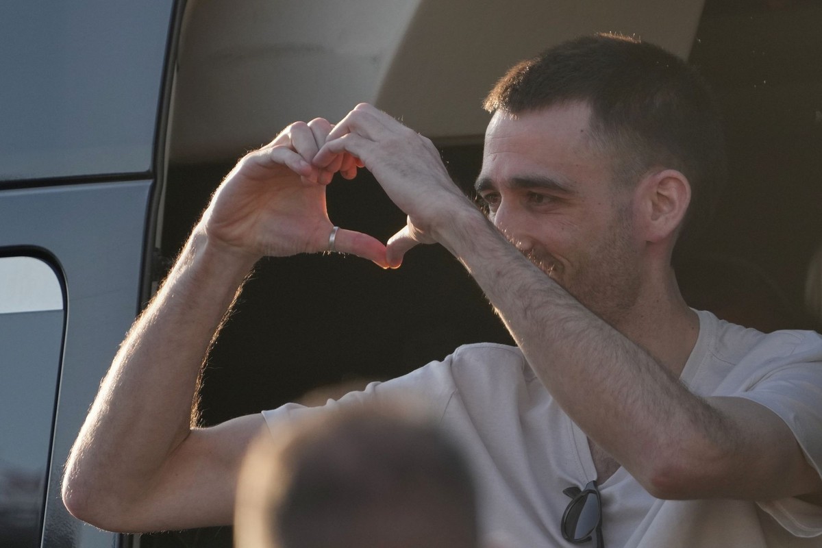 Freed Israeli hostage Avinatan Or gestures from a van as he arrives at Beilinson hospital in Petah Tikva, Israel, after he was released from Hamas captivity in the Gaza Stripl, Monday, Oct. 13, 2025.  ...