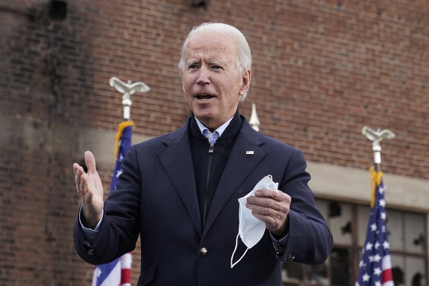 President-elect Joe Biden walks onstage to speak at a drive-in rally for Georgia Democratic candidates for U.S. Senate Raphael Warnock and Jon Ossoff, Tuesday, Dec. 15, 2020, in Atlanta. (AP Photo/Pat ...