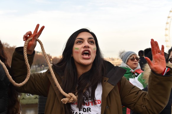 December 17, 2022, London, England, United Kingdom: Protesters take part in a demonstration in central London, calling to stop executions of protesters in Iran, and in solidarity with the freedom upri ...