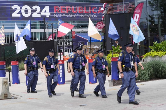 News: Republican National Convention Jul 14, 2024 Milwaukee, WI, USA Michigan State Police officers patrol outside of the Fiserv Forum as preparations continue ahead of the start of the Republican Nat ...