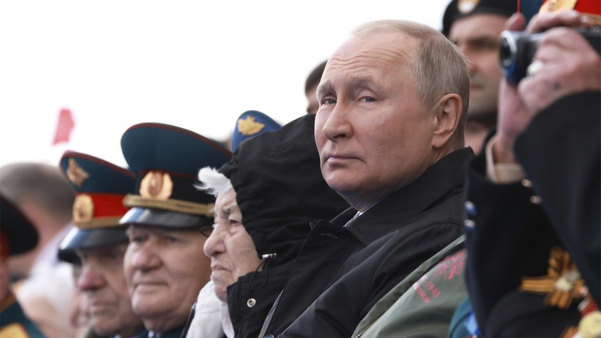 May 9, 2022, Moscow, Moscow Oblast, Russia: Russian President VLADIMIR PUTIN sits in the review stand with veterans at the start of the 77th annual Victory Day military parade celebrating the end of W ...