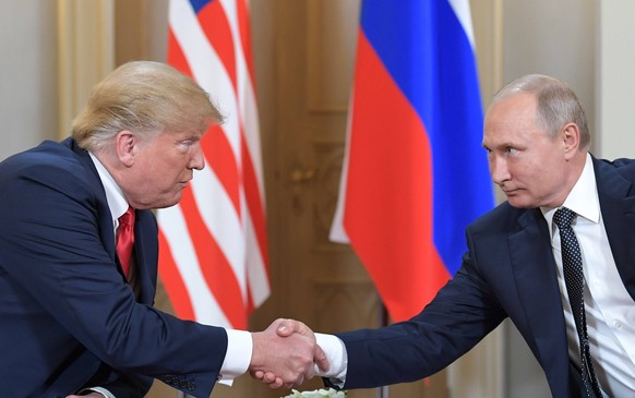 Russian President Vladimir Putin and US President Donald Trump meet in Helsinki 5593656 16.07.2018 July 16, 2018. Russian President Vladimir Putin and US President Donald Trump, left, during a meeting ...