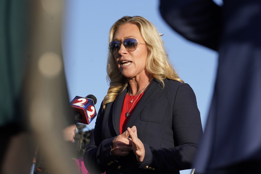 Rep. Marjorie Taylor Greene, R-Ga., is interviewed before former President Donald Trump speaks at a rally in support of the campaign of Ohio Senate candidate JD Vance at Wright Bros. Aero Inc. at Dayt ...