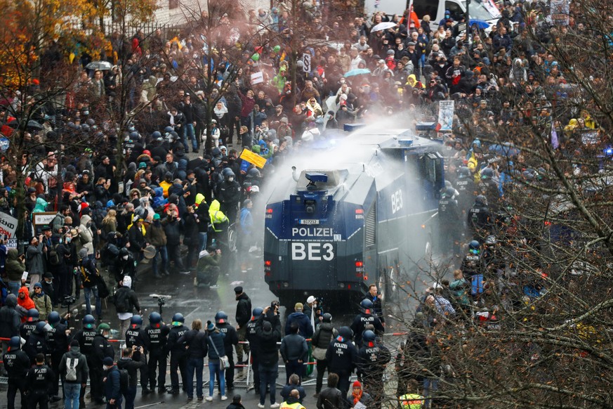 A general view of a protest against the government&#039;s coronavirus disease (COVID-19) restrictions, while police use water cannons, near the Reichstag, the seat of Germany&#039;s lower house of par ...