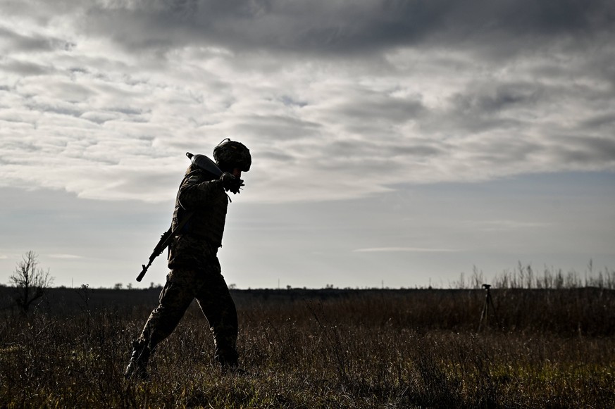 Ukrainian military hones skills UKRAINE - DECEMBER 28, 2023 - A serviceman of an artillery unit of the 128th Mountain Assault Brigade of the Ukrainian Ground Forces carries a shell during a training s ...