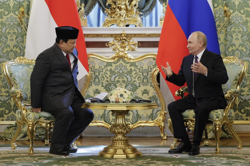 Russian President Vladimir Putin, right, gestures during a meeting with Indonesian Defense Minister and President-Elect Prabowo Subianto, left, at the Kremlin in Moscow, Russia, Wednesday, July 31, 20 ...