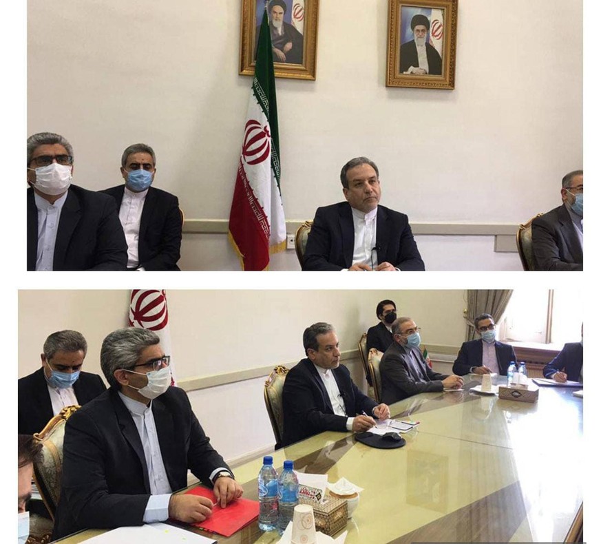 This combined photo released by the Iranian Foreign Ministry, shows Iranian diplomats attending a virtual talk on nuclear deal with representatives of world powers, in Tehran, Iran, Friday, April 2, 2 ...