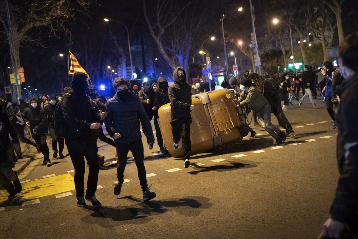 Demonstrators made barricades during clashes with police following a protest condemning the arrest of rap singer Pablo Hasél in Barcelona, Spain, Wednesday, Feb. 17, 2021. Police fired rubber bullets ...