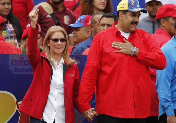 Venezuela's President Nicolas Maduro and first lady Cilia Flores acknowledge supporters at the end of a rally in Caracas, Venezuela, Saturday, Feb. 2, 2019. Maduro called the rally to celebrate the 20 ...